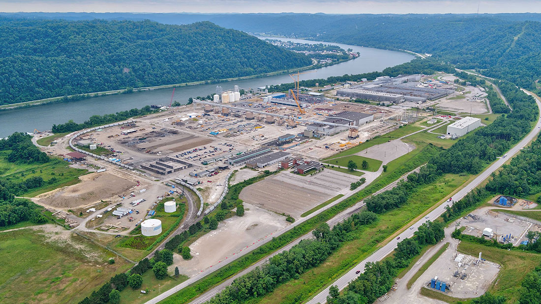 Site overview during power plant construction, looking southeast